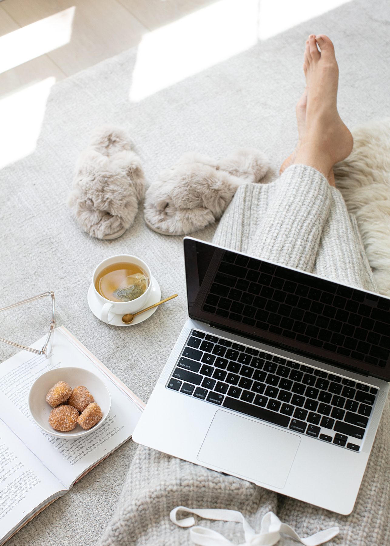 Woman business owner writing in planner at desk — quarterly planning for small business